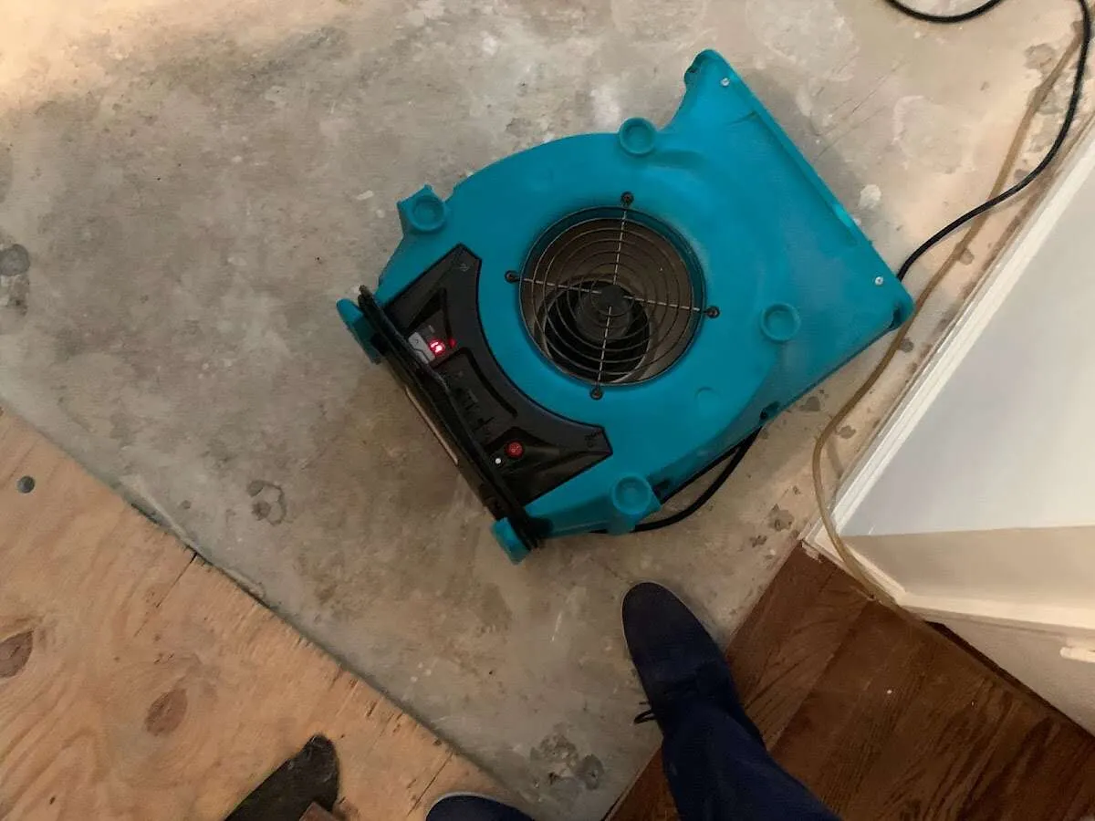 Air mover drying subfloor during Leak Detection & Repair in Bowleys Quarters